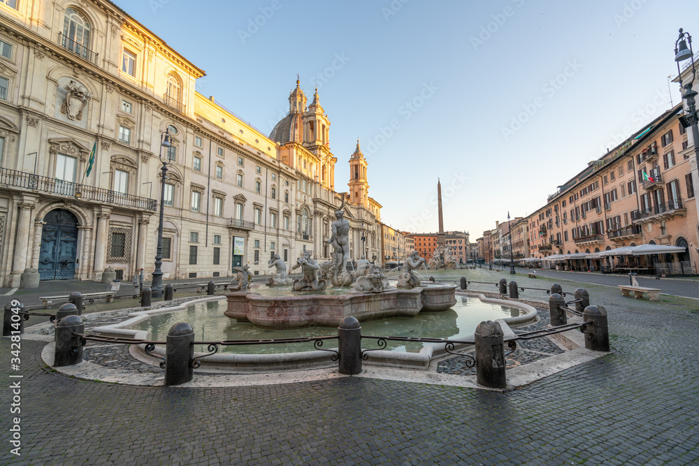 Piazza Navona in Rome appears like a ghost city during the covid emergency  lock down, grass on the floor