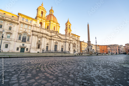 Piazza Navona in Rome appears like a ghost city during the covid emergency lock down, grass on the floor