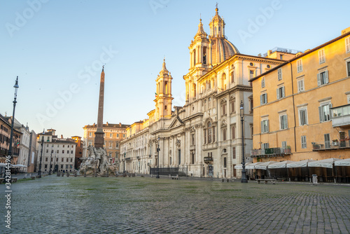 Piazza Navona in Rome appears like a ghost city during the covid emergency lock down, grass on the floor