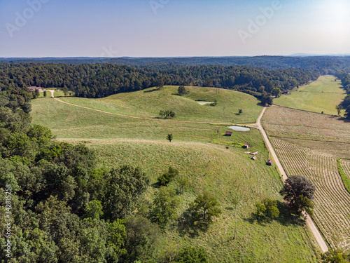 Aerial view of rural farmland on a sunny summer day.