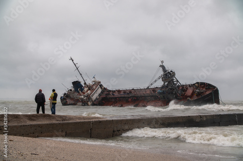 The ship received a hole in the hull and sank near the shore during a storm
