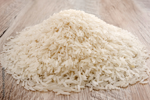a bunch of long grain rice. Indian rice groats. Close-up.