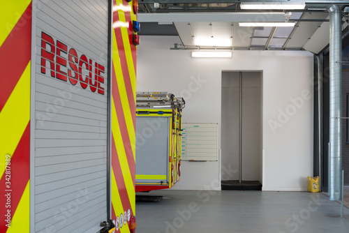 Fire engines in garage and firefighters pole, Basingstoke Fire Station