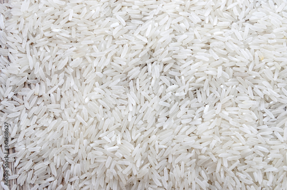white long rice, background. Indian rice groats. white long rice, background. Indian rice groats.
