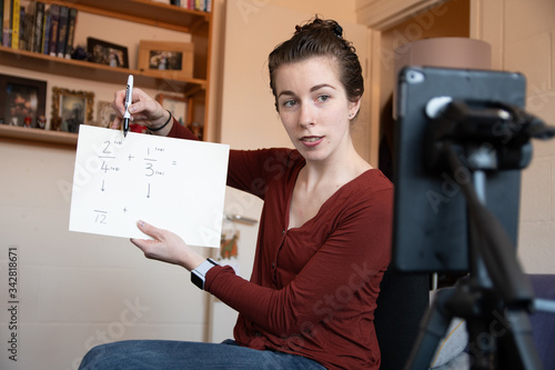 School teachers are forced to teach their lessons from home using their phones to video themselves