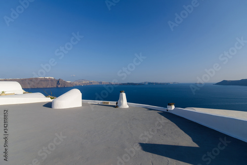 Roof of hotels on the background of the Mediterranean Sea on the island of Santorini, Oia village. © wolfhound911
