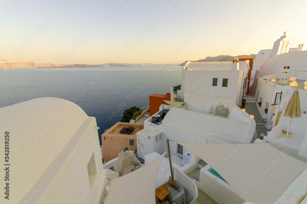 Panorama of the city during sunset in the village of Oia, Santorini.