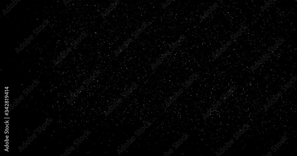 abstract Flying dust particles on a black background abstract Flying dust particles on a black background