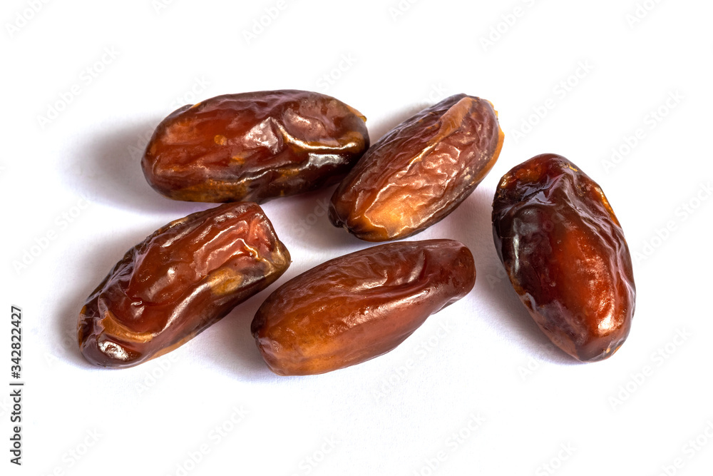 Dry dates on a white isolated background Dry dates on a white isolated background