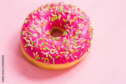 Pink donut on a pink background © alexander132