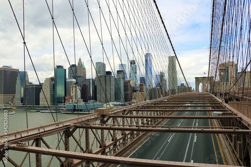 Manhattan  New York  United States. The Brooklyn bridge structure with the skyline of Manhattan in background.