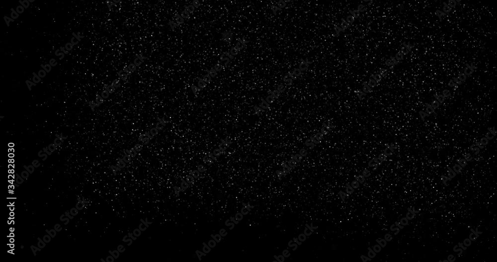 abstract Flying dust particles on a black background abstract Flying dust particles on a black background