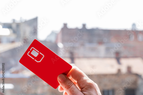 SIM card slot sity sky hand street red copy space 4G 5G