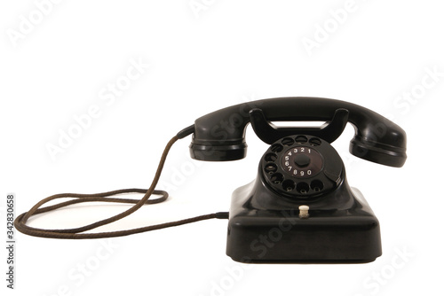 Black classic retro phone with landline cable isolated on white