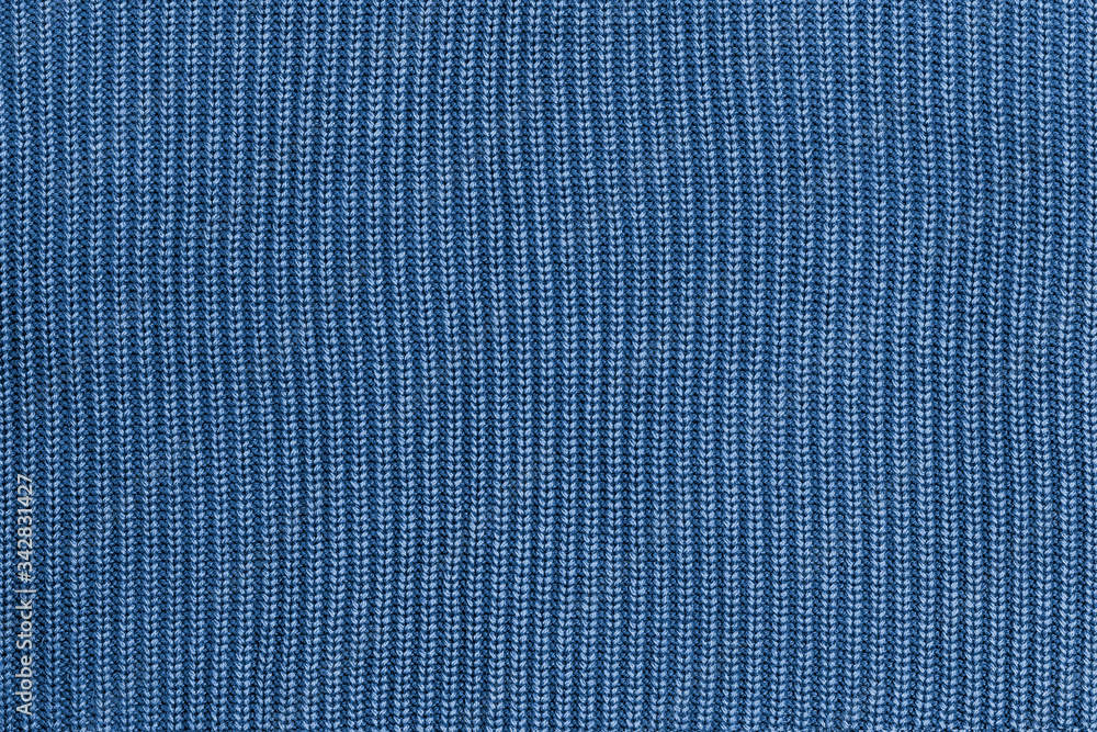 Blue knitted fabric texture background. Blue knitted fabric texture background.