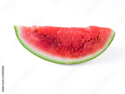 Sliced Watermelon on white plate with spoon and fork stock photo with bright background. 