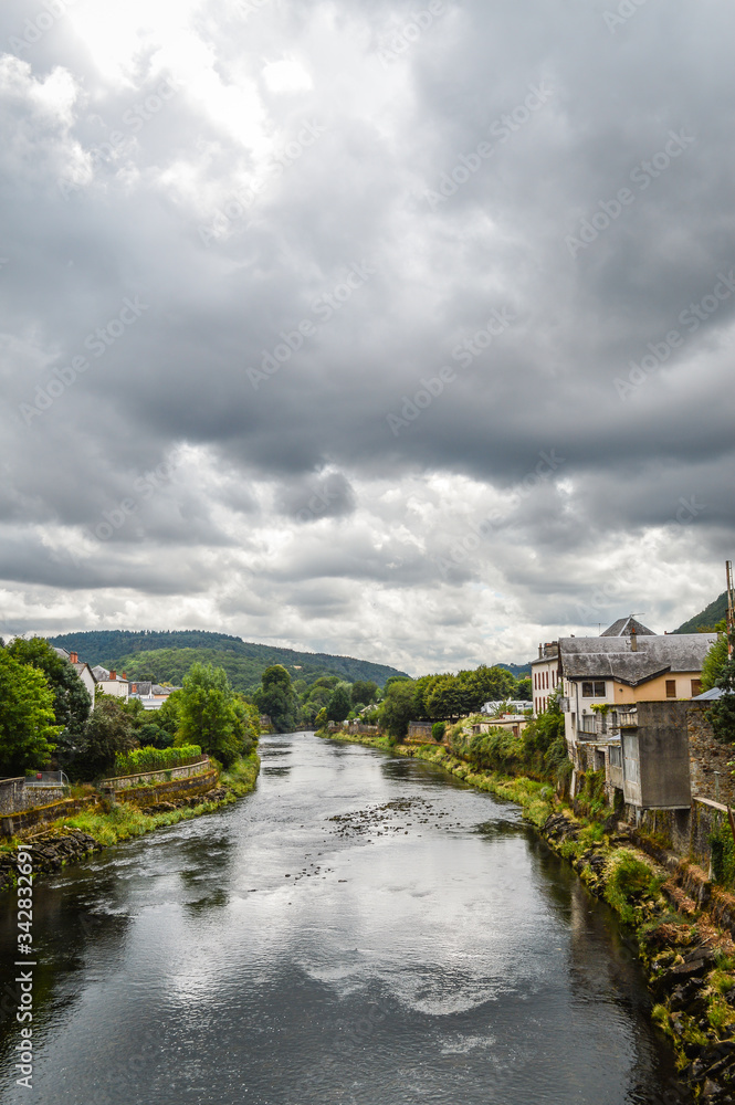 View of the river Dordogne at Bort les Orgues, a little french village in Correze, Auvergne. The beauty of the river in a very cloudy day.