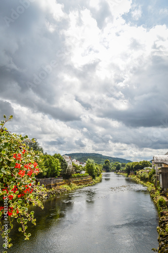 View of the river Dordogne at Bort les Orgues, a little french village in Correze, Auvergne. The beauty of the river in a very cloudy day. photo