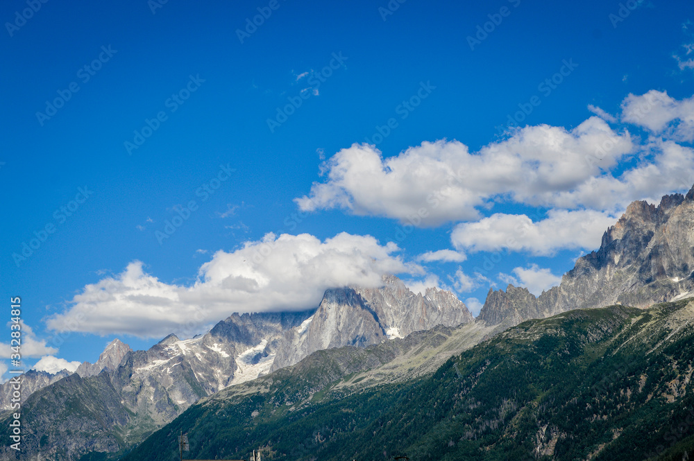 French Alps mountains in a cloudy summer day, seen from Les Houches near Chamonix, Haute Savoy, France.