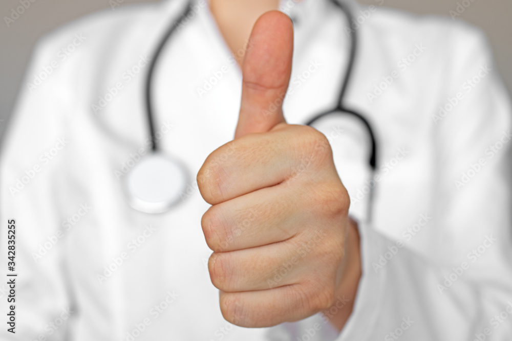 Female doctor with thumb up gesture Female doctor with thumb up gesture
