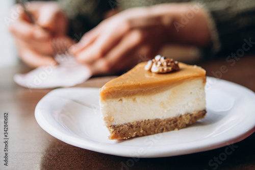 delicious caramelized nut cheesecake on the table in cafe