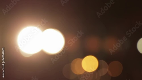 Abstract bokeh stage light at a music concert. Defocused entertainment lighting on stage. Blurred disco party.
