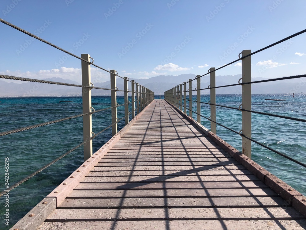 Fototapeta premium wooden bridge over the sea