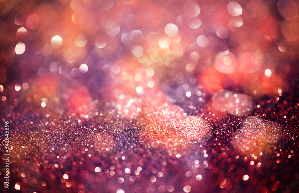 Pink glittering Christmas lights. Blurred abstract background