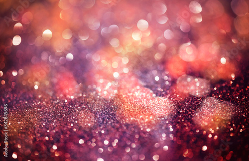 Pink glittering Christmas lights. Blurred abstract background