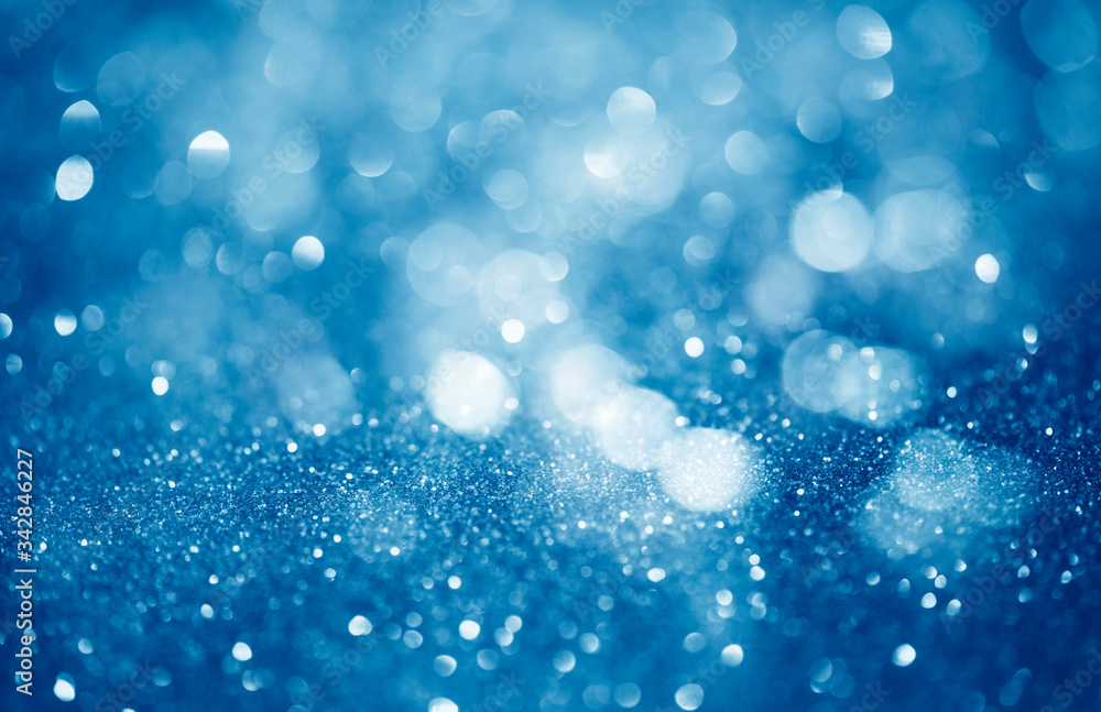 blue defocused glitter background with copy space