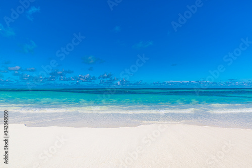 Fototapeta Naklejka Na Ścianę i Meble -  Sea sand sky concept. Closeup of sand on beach and blue summer sky, calmness and inspiration nature concept
