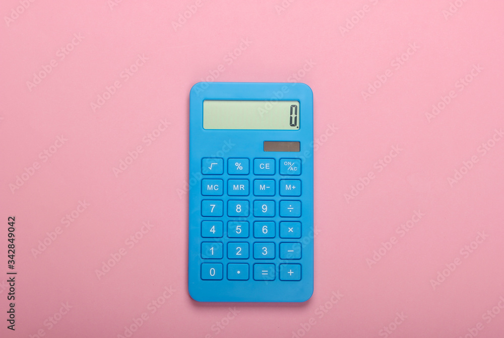Blue calculator on pink pastel background. Calculation or counting. Minimalism. Top view Blue calculator on pink pastel background. Calculation or counting. Minimalism. Top view