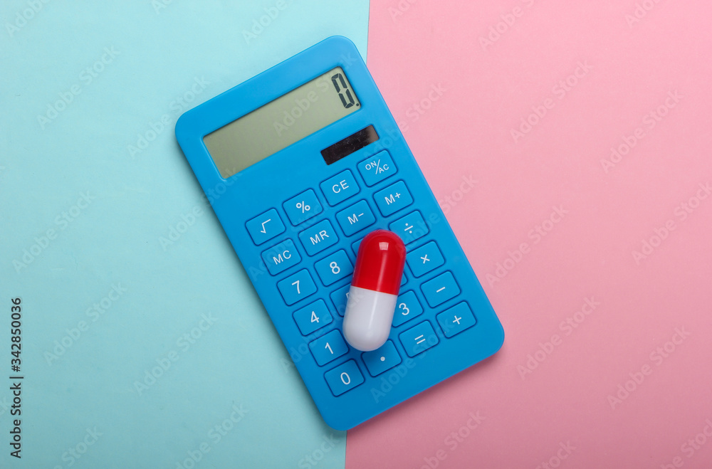Calculation of the cost of medical expenses. Calculator and pill on a blue-pink pastel background. Top view. Minimalism Calculation of the cost of medical expenses. Calculator and pill on a blue-pink pastel background. Top view. Minimalism