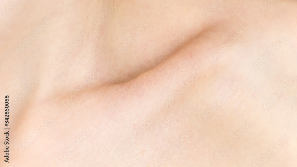 Collarbone. Detailed texture of human skin. Close up shot of a young ...