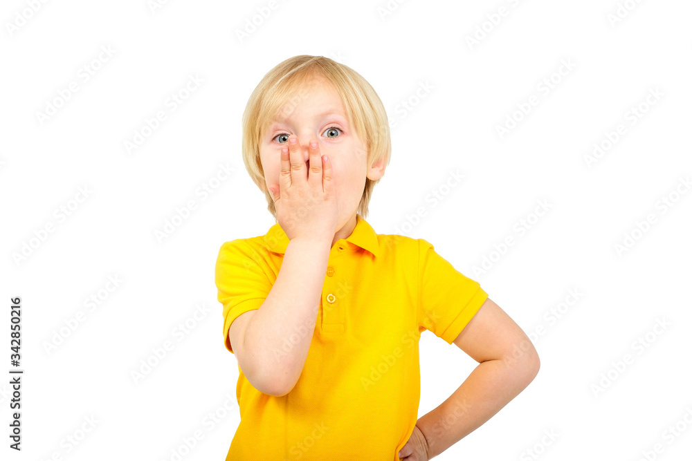 Surprised boy closes his mouth with his hand Surprised boy closes his mouth with his hand
