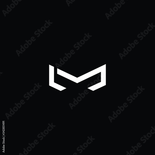 Minimal elegant monogram art logo. Outstanding professional trendy awesome artistic M LM ML initial based Alphabet icon logo. Premium Business logo White color on black background