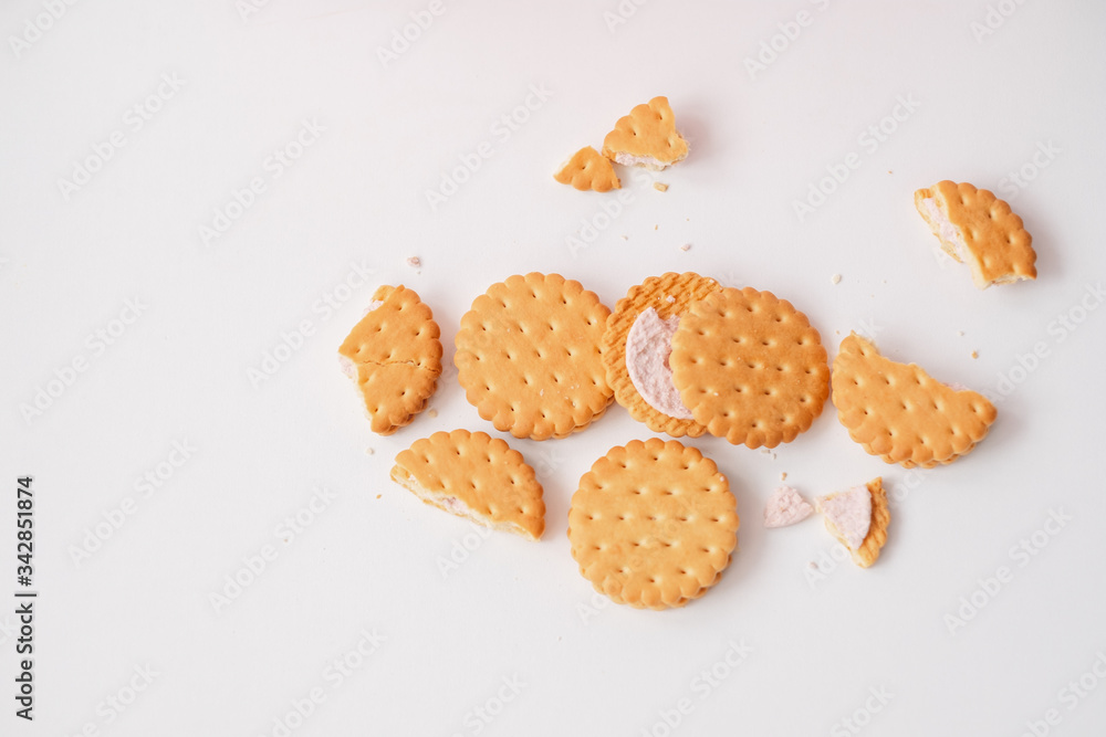Sweet creamy filling crackers on a white pastel background. Flat lay Sweet creamy filling crackers on a white pastel background. Flat lay