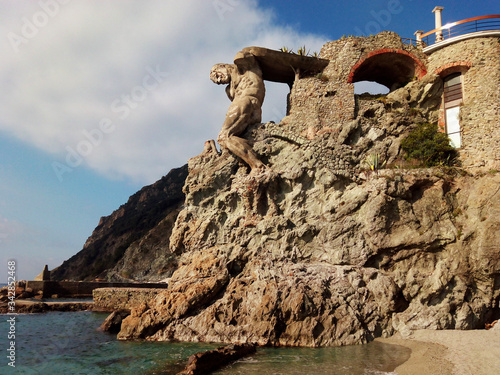 Colossal statue of Hercules. Beach of Monterosso al Mare. Cinque Terre. Italy.      