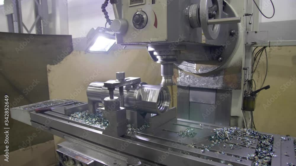 Milling machine cuts metal making part. Process of metalworking. Milling machine cuts metal making part. Process of metalworking.
