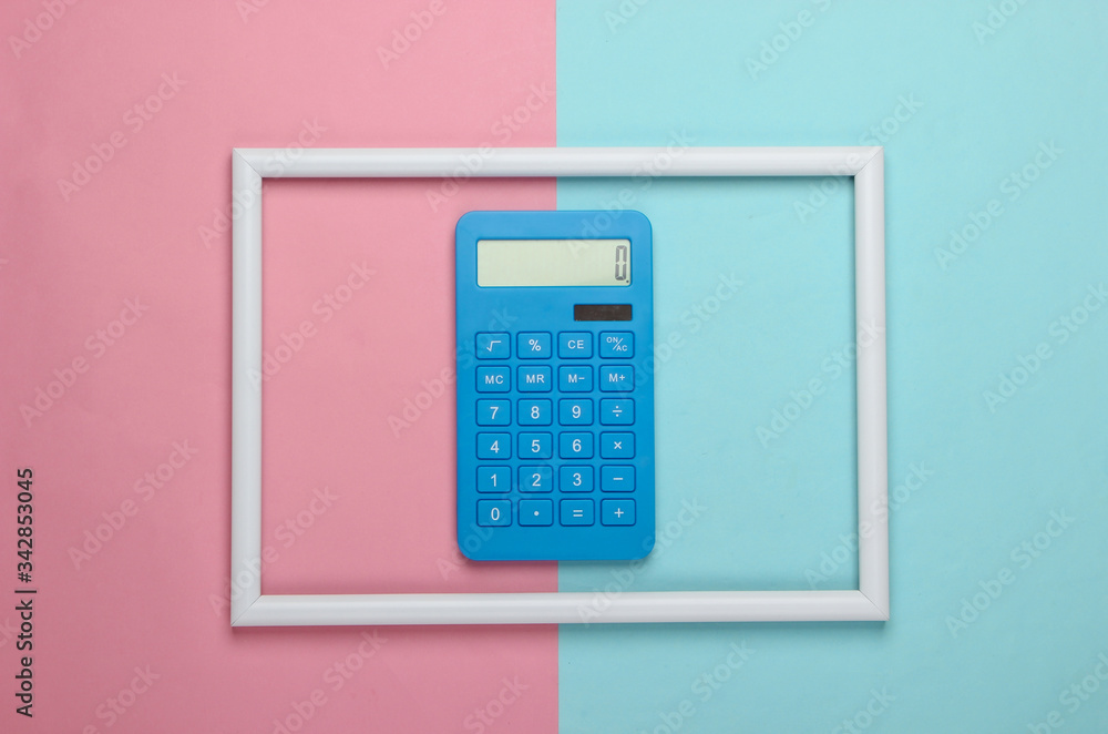 Calculator in a white frame on pink blue background. Concept art photo. Top view. Minimalism Calculator in a white frame on pink blue background. Concept art photo. Top view. Minimalism