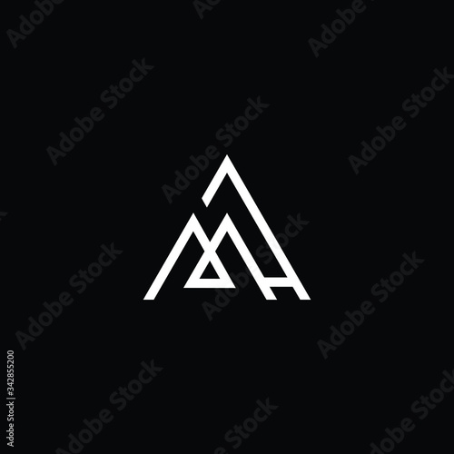 Minimal elegant monogram art logo. Outstanding professional trendy awesome artistic MH HM initial based Alphabet icon logo. Premium Business logo White color on black background