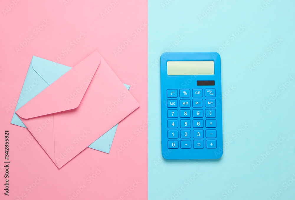 Calculator with an envelopes on pink blue pastel background. Top view Calculator with an envelopes on pink blue pastel background. Top view