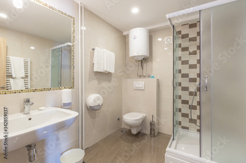 Bathroom interior with glass shower cabin