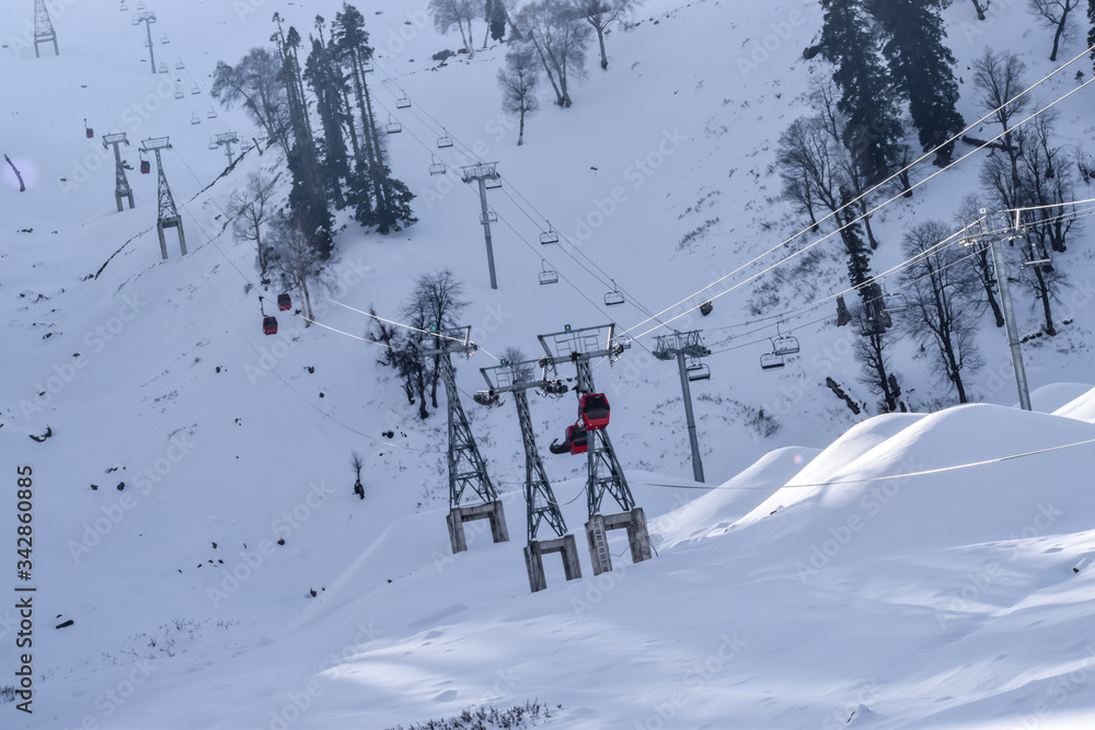 Gulmarg Gondola phase 1, Kungdoor, Kashmir. Snow/ice adventure activities snow rides, snow boarding, ice skating and world famous ski slopes for skiing. Christmas & New year holidays in Kashmir, India Gulmarg Gondola phase 1, Kungdoor, Kashmir. Snow/ice adventure activities snow rides, snow boarding, ice skating and world famous ski slopes for skiing. Christmas & New year holidays in Kashmir, India