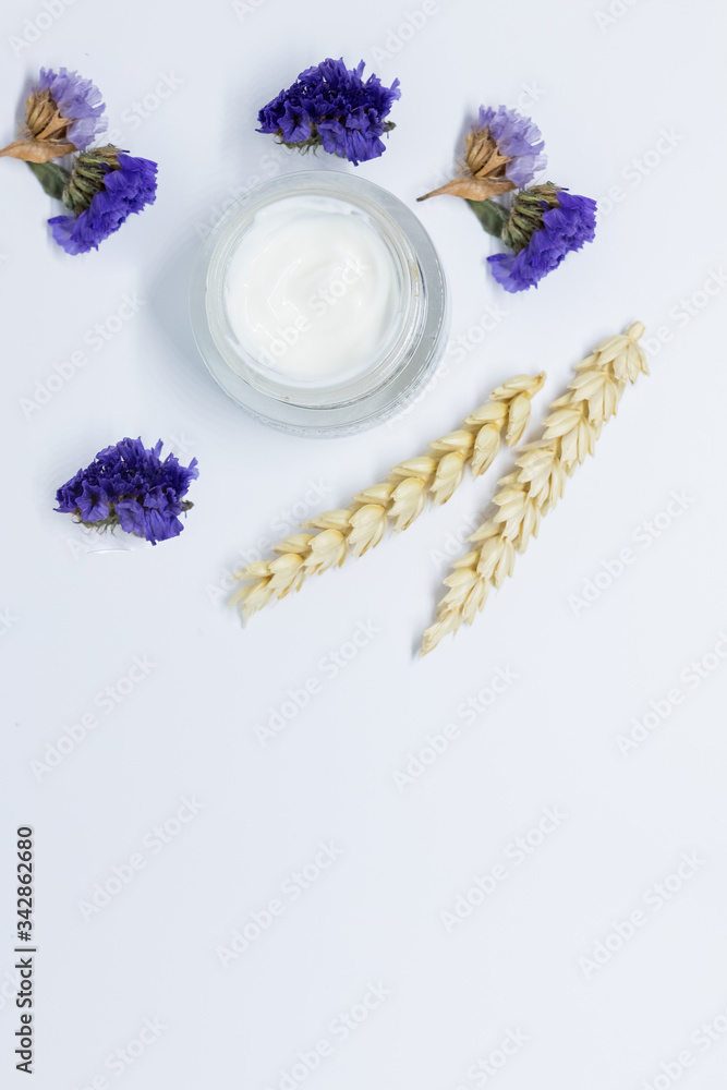 Open cream jar with wheat spikelets top view. Mourishing face mask with natural oat extract components. cosmetics, jar with daily cream with wheat .Professional skincare, organic cosmetics concept Open cream jar with wheat spikelets top view. Mourishing face mask with natural oat extract components. cosmetics, jar with daily cream with wheat .Professional skincare, organic cosmetics concept