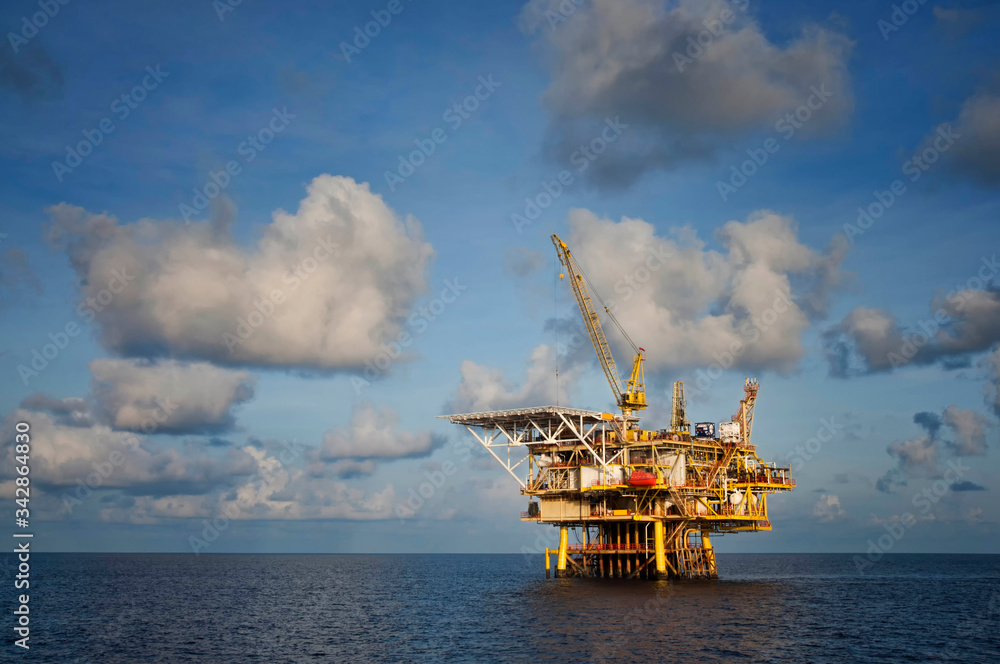 oil platform at sea with beautiful blue cloudy sky