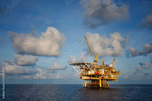 oil platform at sea with beautiful blue cloudy sky