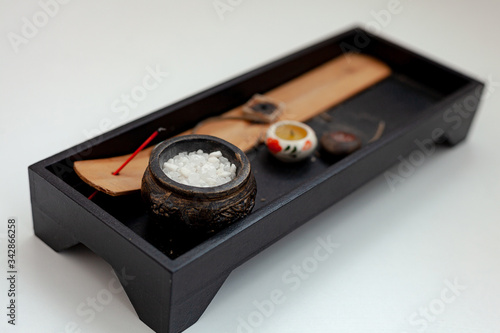 Incense sticks. Wooden stand for burning incense sticks on a white background. Indian theme.