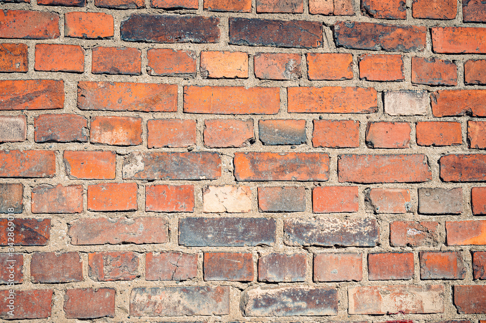 Fototapeta premium Closeup of an old red brick wall.
