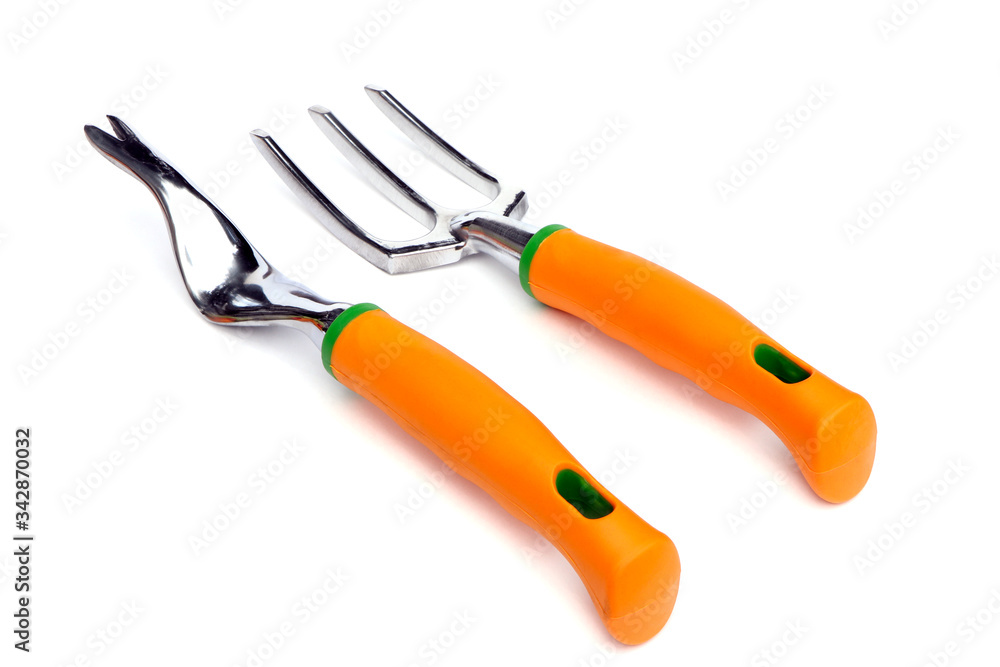 Fototapeta premium Garden tools . Garden root remover and fork isolated on a white background. Root remover and fork for gardening.